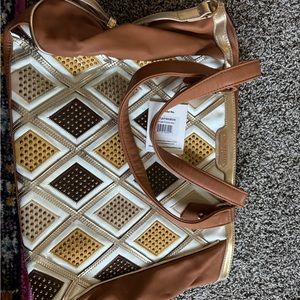 Nicole Lee shoulder bag w/straps to wear as crossbody.